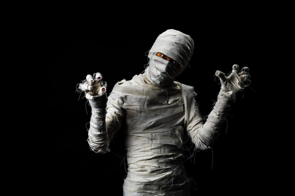 Person in mummie costume for a Halloween haunted house.