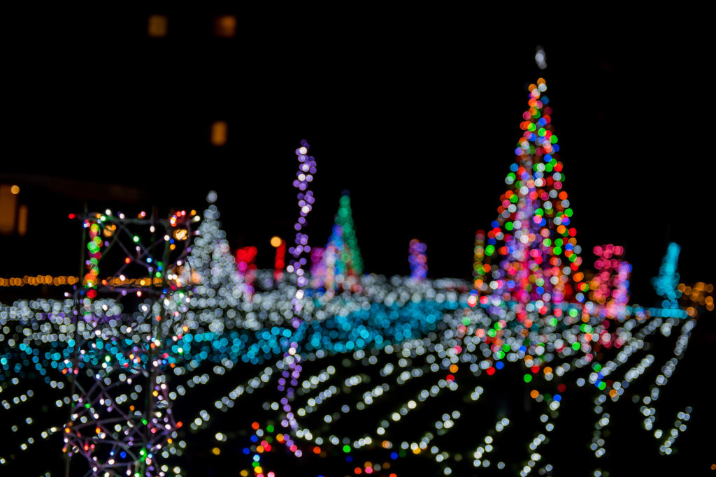 Blurry Christmas lights in a drive-thru lights experience.