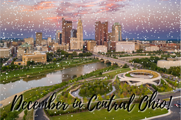 Downtown Columbus skyline at sunset with Snow falling displaying text, "December in Central Ohio"