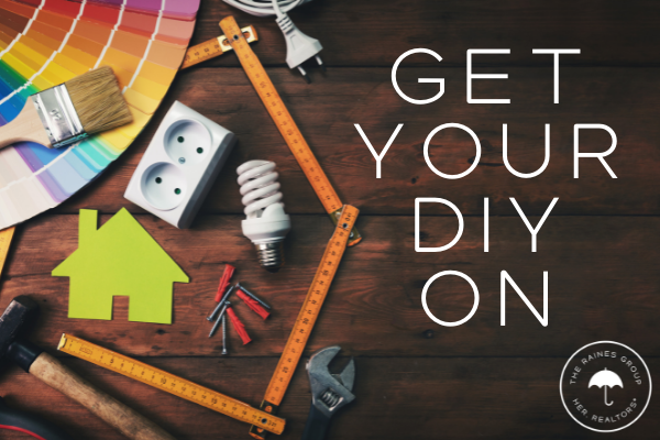 Photo of tools on wooden background with text "Get your DIY on" and The Raines Group Logo.