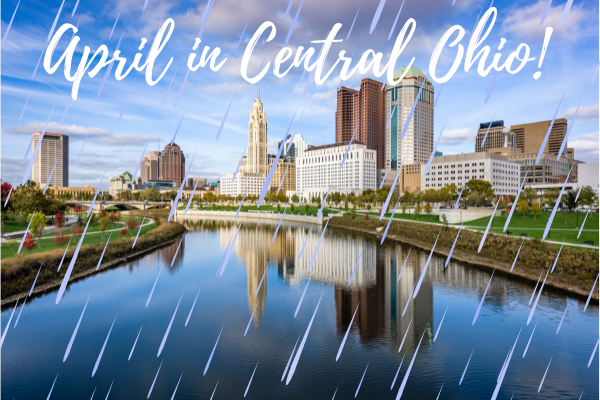Downtown Columbus, Ohio skyline from the Scioto River with text "April in Central Ohio" and rain falling.